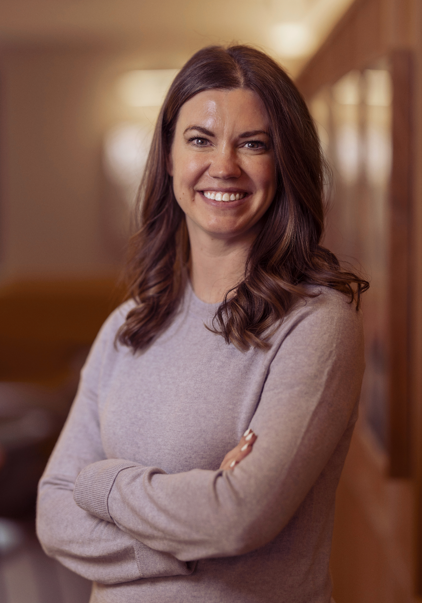 Nicole Paulie is the Corporate Mental Health Clinical Lead at Spectrum.Life seen posing for a photo in pale grey color outfit